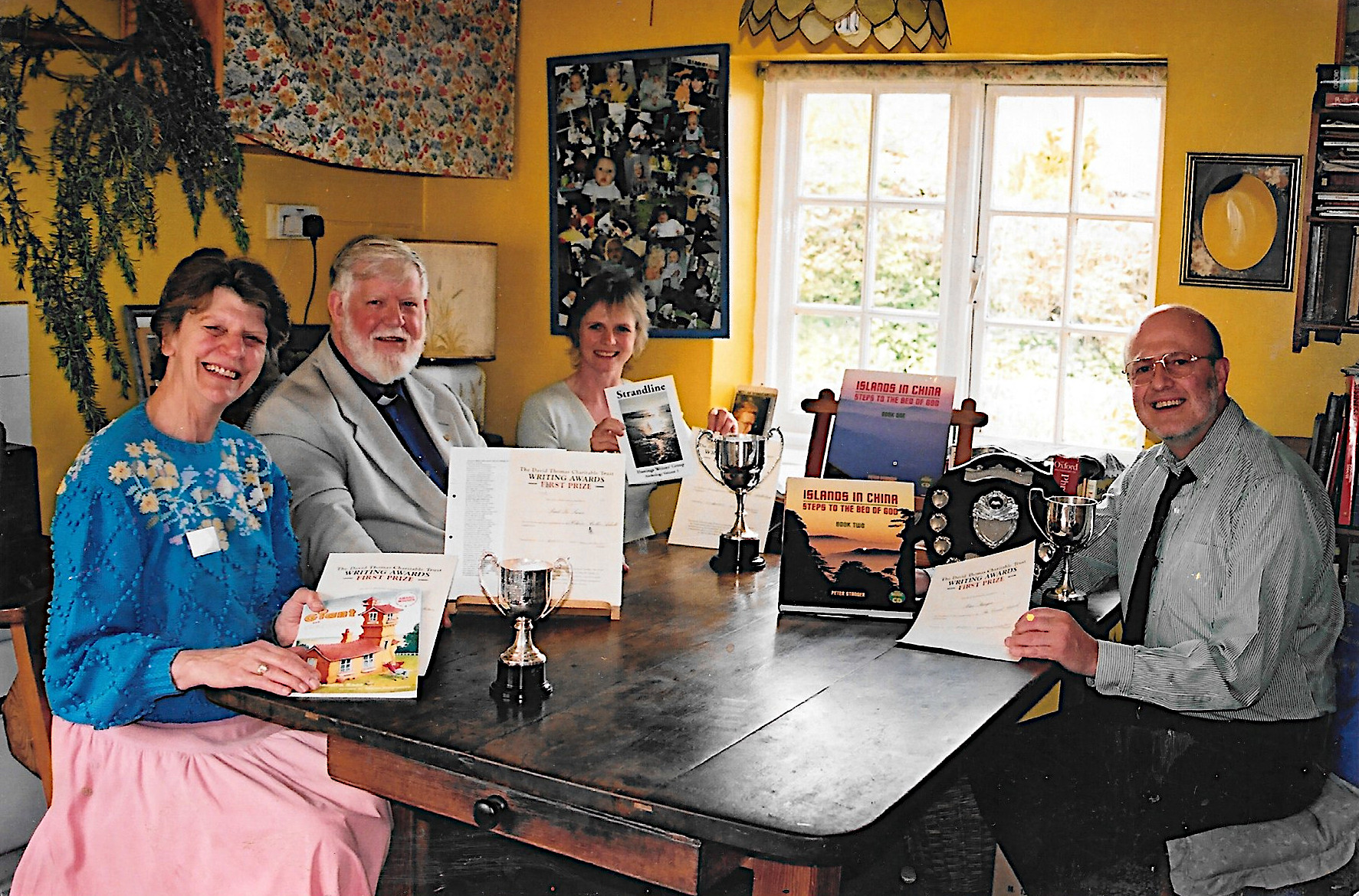 Sandra, celebrating round her kitchen table with other award-winners